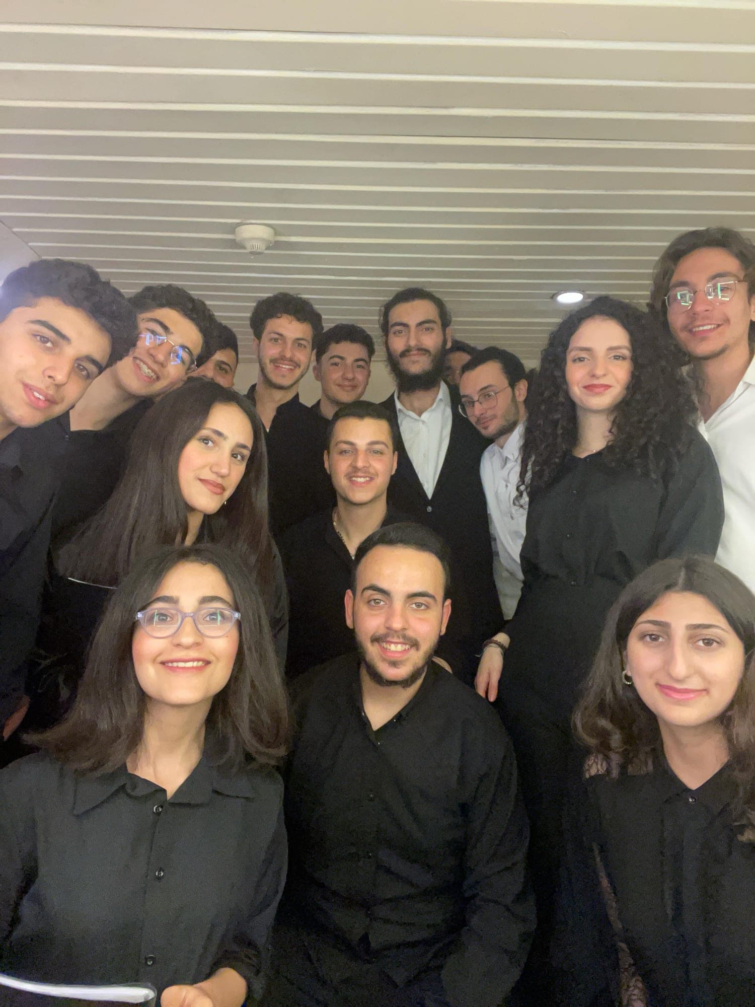 Choir members gathered for a backstage selfie