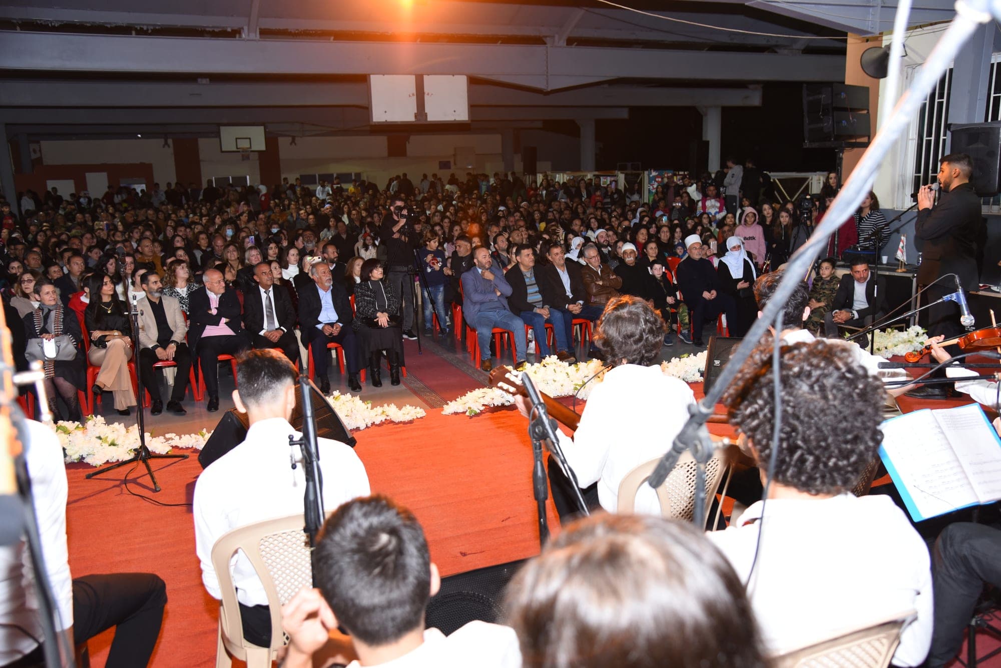 The audience filling the concert hall