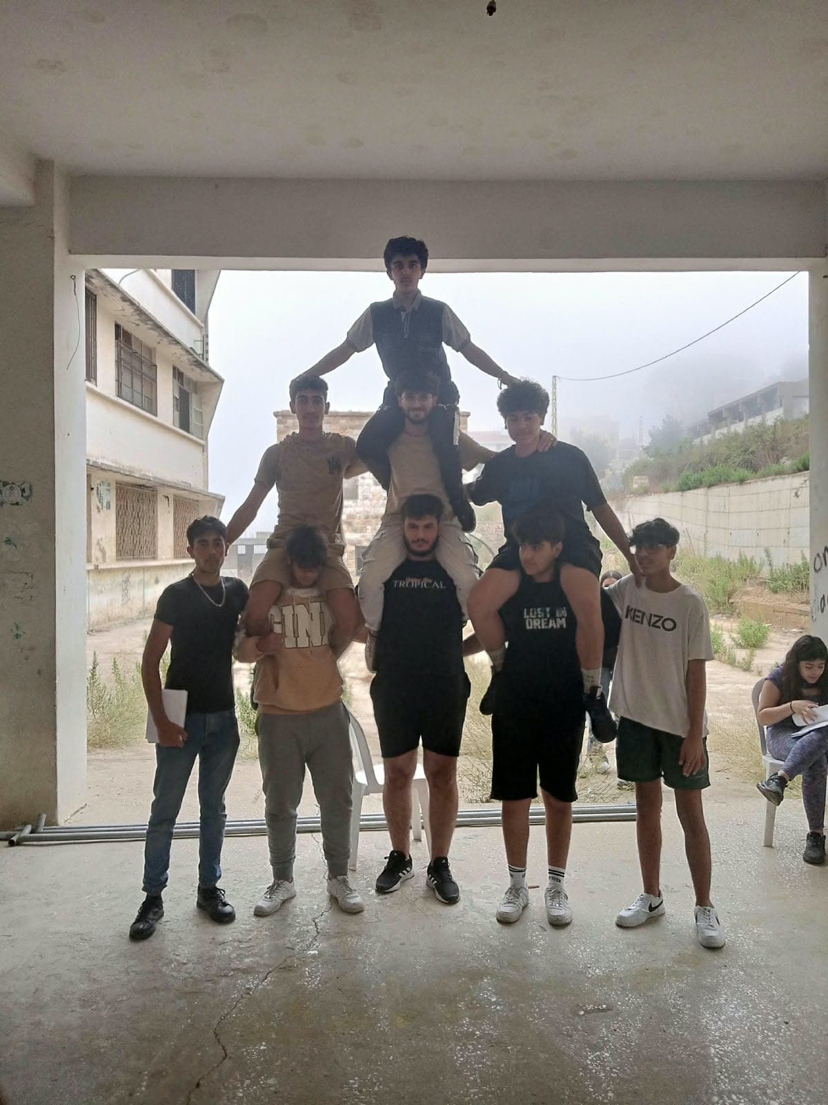 Members forming a human pyramid